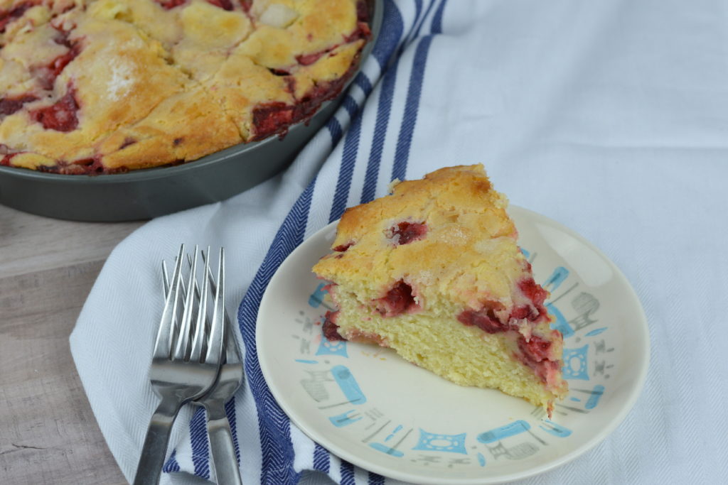 This Strawberry Cake is so simple to make, it's light, custardy and full of fresh berries. Your new favorite summertime treat!