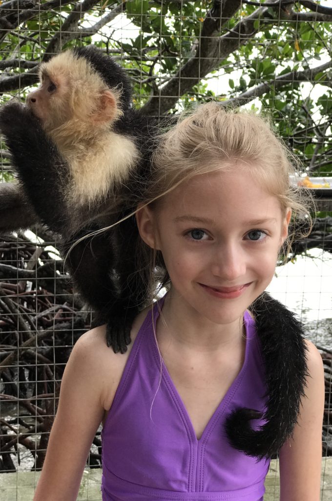 Are you traveling to Roatan, Honduras? I am telling you about our time in Roatan including hugging a sloth and horseback riding in the ocean.