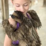 Are you traveling to Roatan, Honduras? I am telling you about our time in Roatan including hugging a sloth and horseback riding in the ocean.