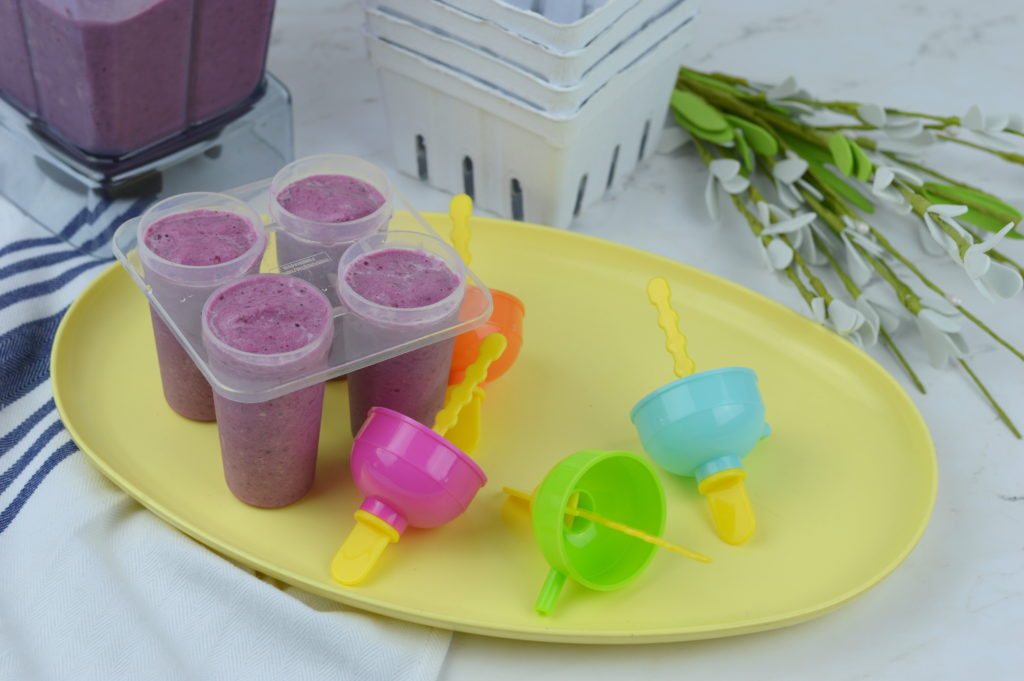 These mixed berry yogurt popsicles are so full of fresh fruit and nutrients it's almost like a smoothie on a stick.