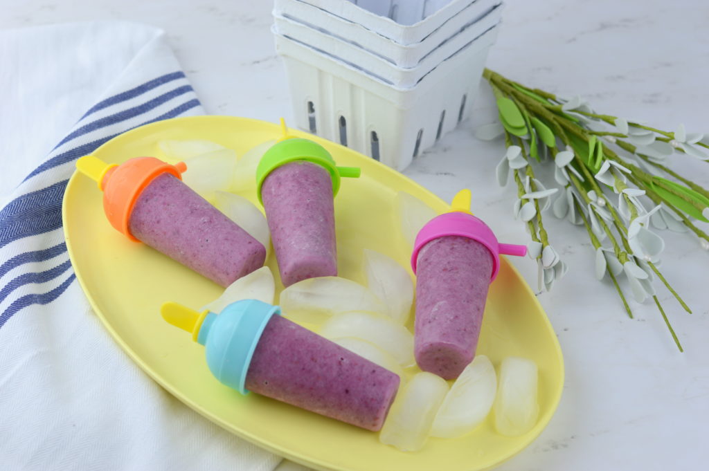 These mixed berry yogurt popsicles are so full of fresh fruit and nutrients it's almost like a smoothie on a stick.