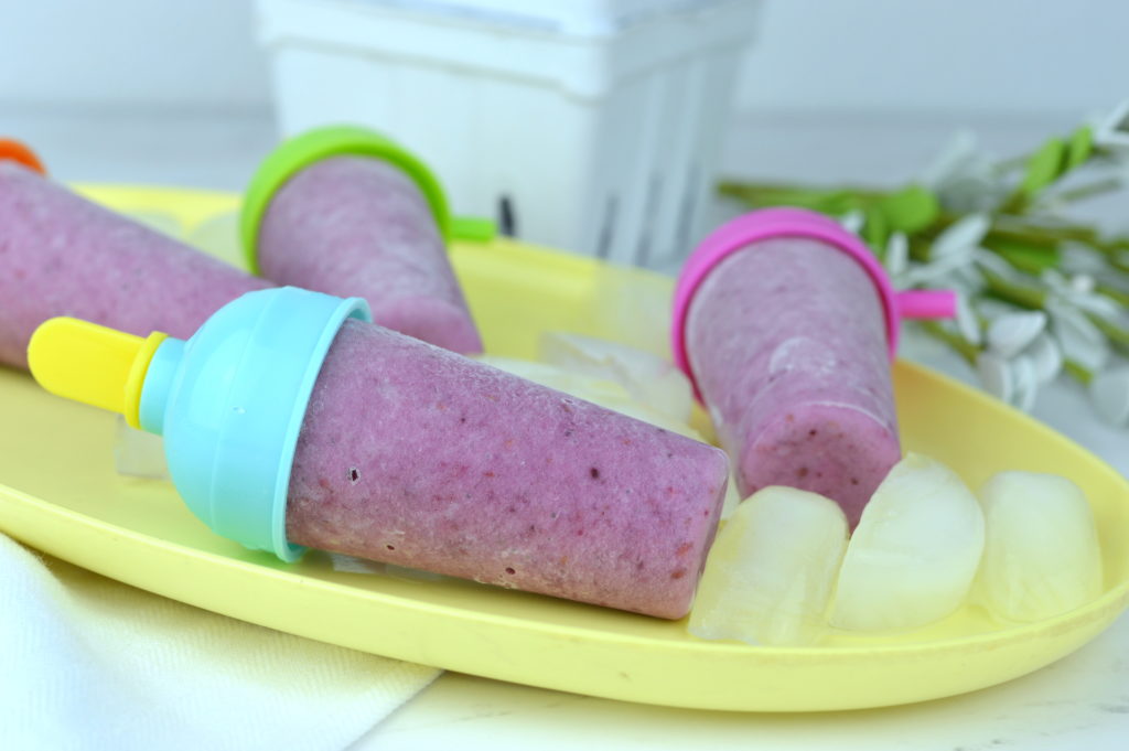 These mixed berry yogurt popsicles are so full of fresh fruit and nutrients it's almost like a smoothie on a stick.