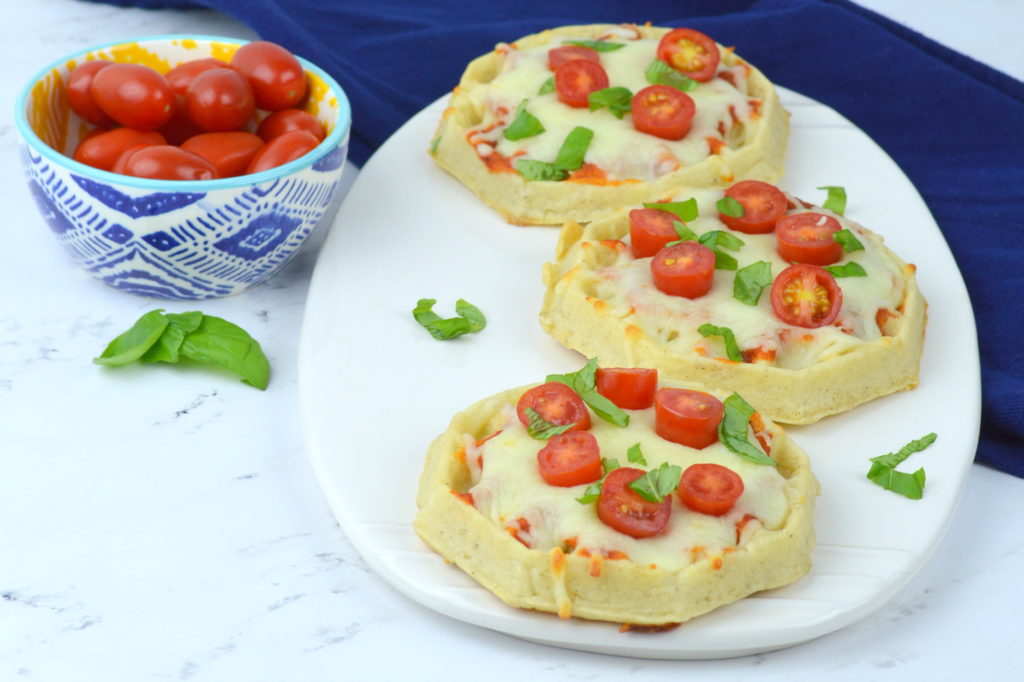 Waffle Pizzas are a family favorite all you need is your favorite pizza sauce, Eggo Thick & Fluffy waffles, mozzarella, cherry tomatoes, & basil - quick, easy, & yummy!