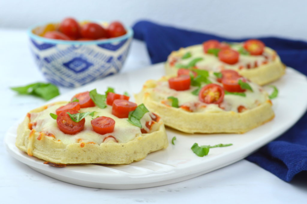 Waffle Pizzas are a family favorite all you need is your favorite pizza sauce, Eggo Thick & Fluffy waffles, mozzarella, cherry tomatoes, & basil - quick, easy, & yummy!