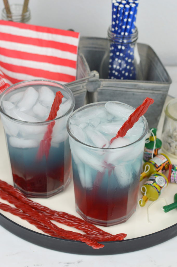 This festive kid friendly red, white, and blue layered drink is perfect for the 4th of July holiday. Your child will love this 4th of July drink.