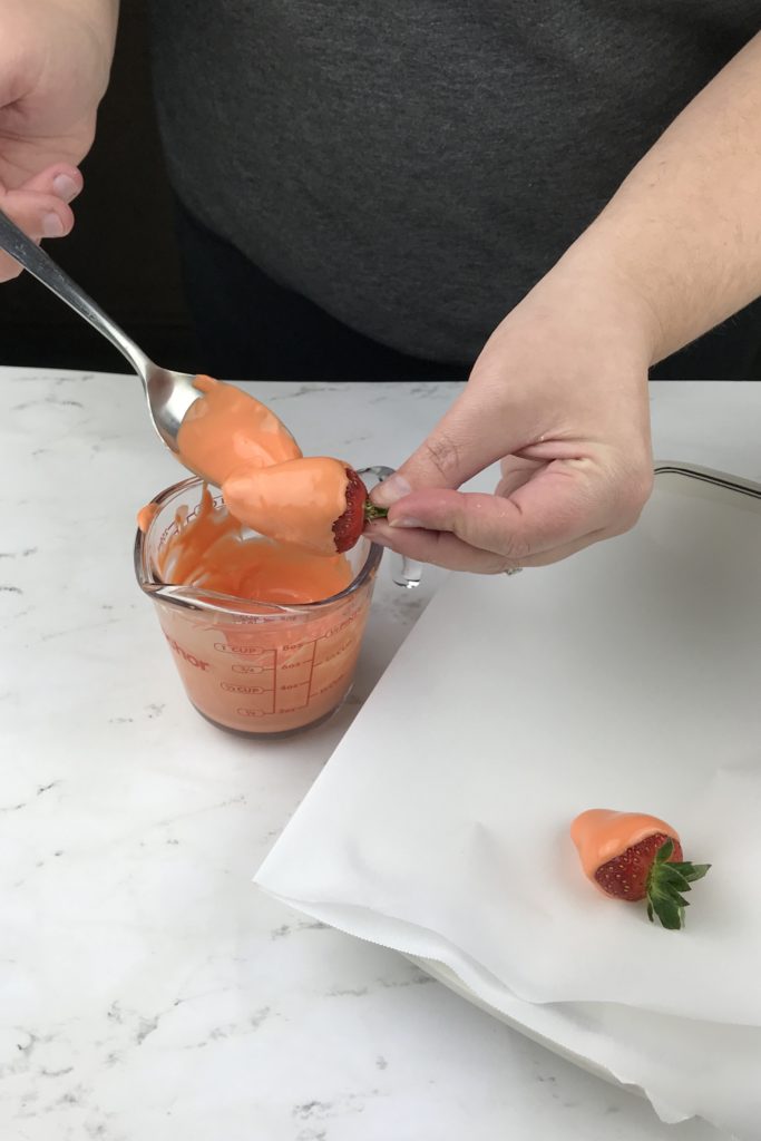 These adorable Carrot Patch Dirt Cups are perfect for spring and easy to make using store bought pudding cups, topped with crumbled chocolate sandwich cookies, and chocolate-covered strawberry “carrots”.  