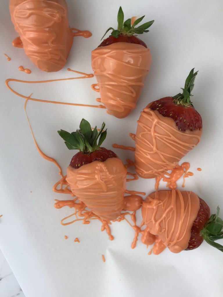 These adorable Carrot Patch Dirt Cups are perfect for spring and easy to make using store bought pudding cups, topped with crumbled chocolate sandwich cookies, and chocolate-covered strawberry “carrots”.  