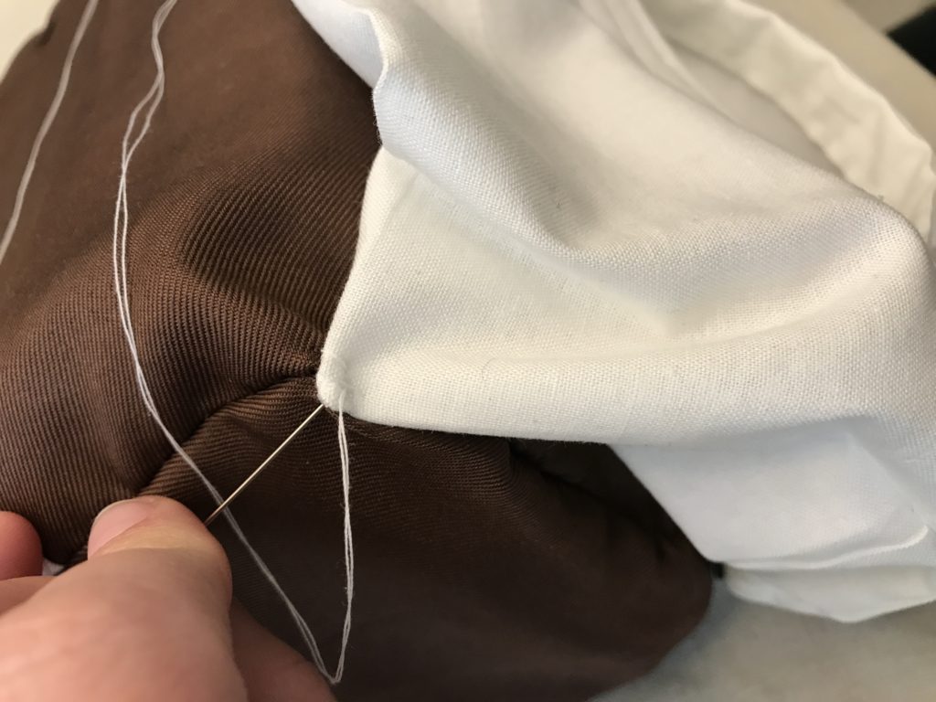 Easy to follow directions on how to sew a pocket to the bottom of your purse which is a good way to hide important items while traveling.