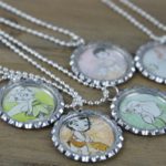 These fun and easy bottle cap necklaces are a great DIY craft for fish extender or pixie dust gifts for your next Disney Cruise.