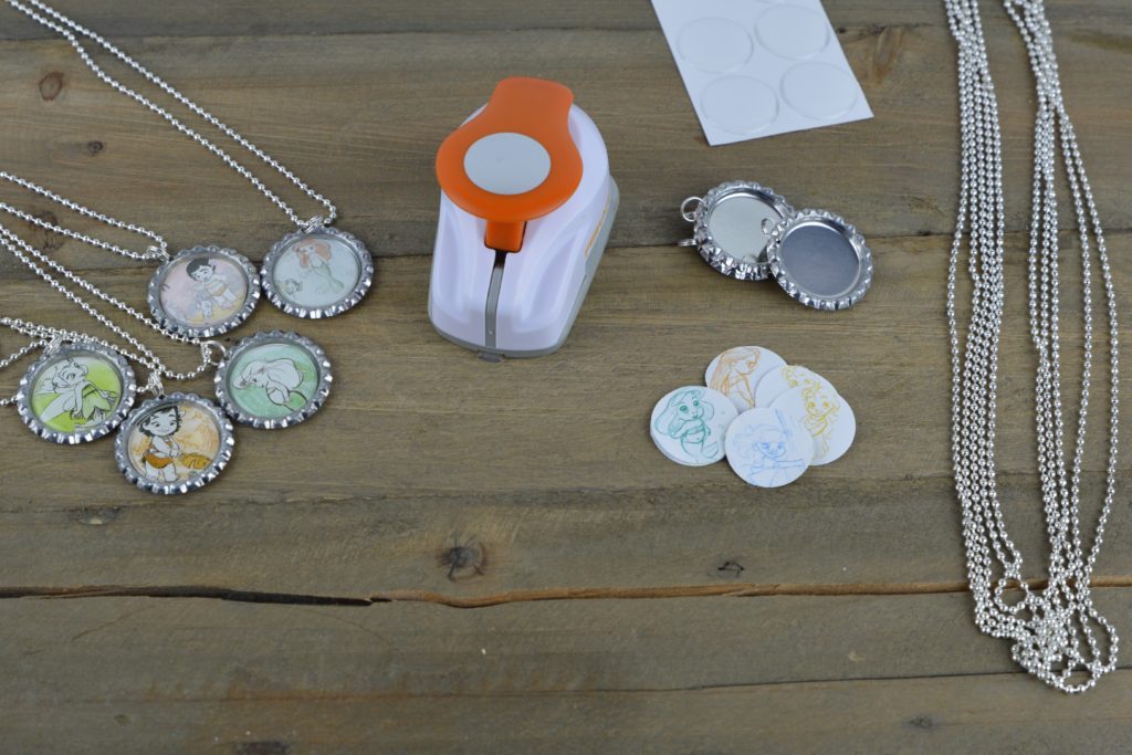 These fun and easy bottle cap necklaces are a great DIY craft for fish extender or pixie dust gifts for your next Disney Cruise.