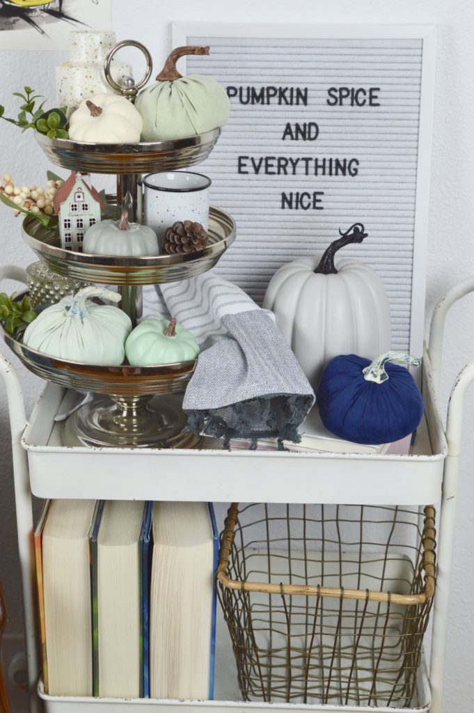 Simple tips to help you create a beautiful fall vignette in your home including using a 3-tier tray full of pumpkins and holiday spice.