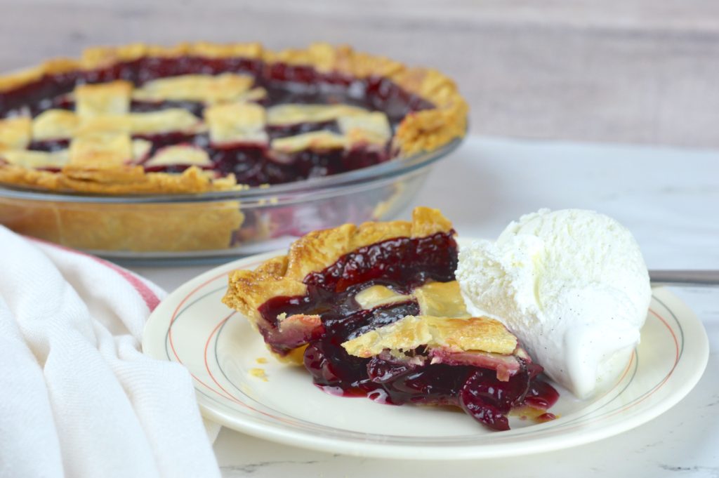 This easy and delicious cherry pie has a flaky crust that is filled with homemade cherry pie filling.  It is bursting with cherry flavor that's both sweet and tart. 