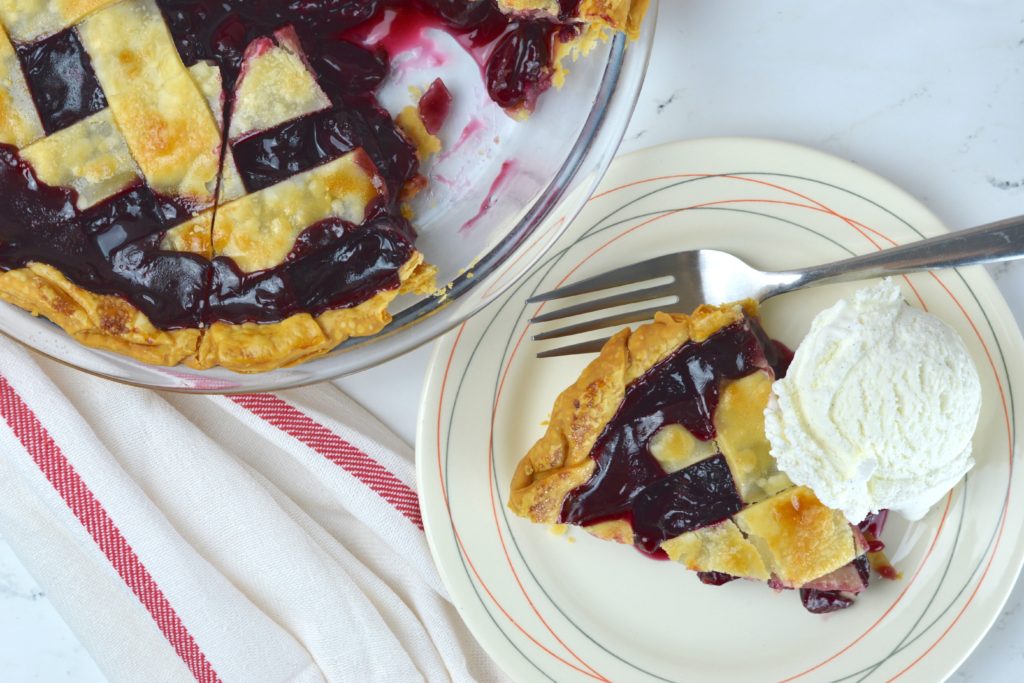 This easy and delicious cherry pie has a flaky crust that is filled with homemade cherry pie filling.  It is bursting with cherry flavor that's both sweet and tart. 