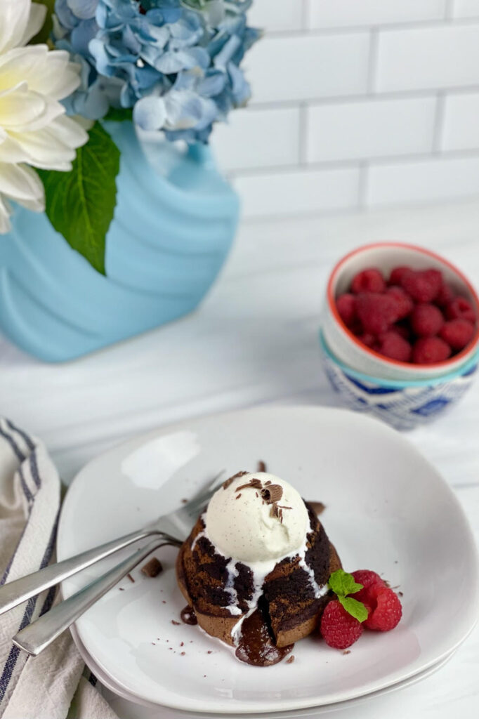 This decadent Lava Cake is filled with gooey, melted chocolate surrounded by moist chocolate cake. It is the perfect dessert for an easy fancy dessert.