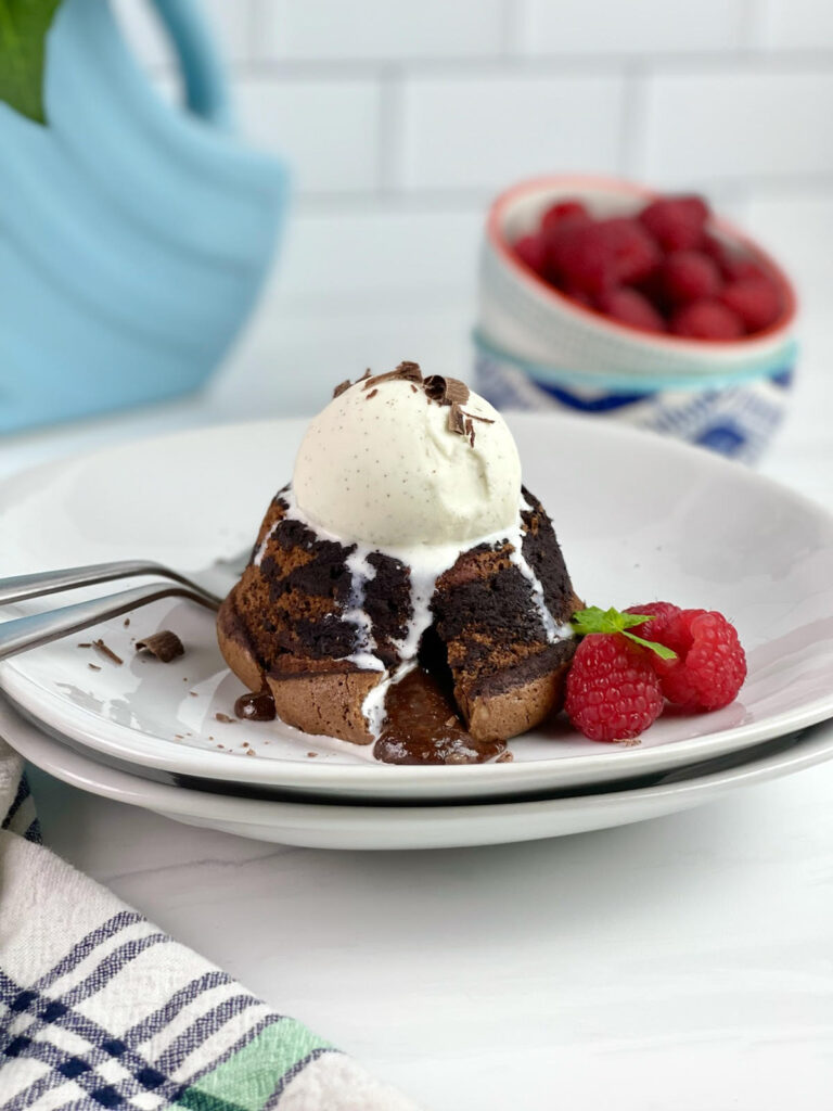 This decadent Lava Cake is filled with gooey, melted chocolate surrounded by moist chocolate cake. It is the perfect dessert for an easy fancy dessert.