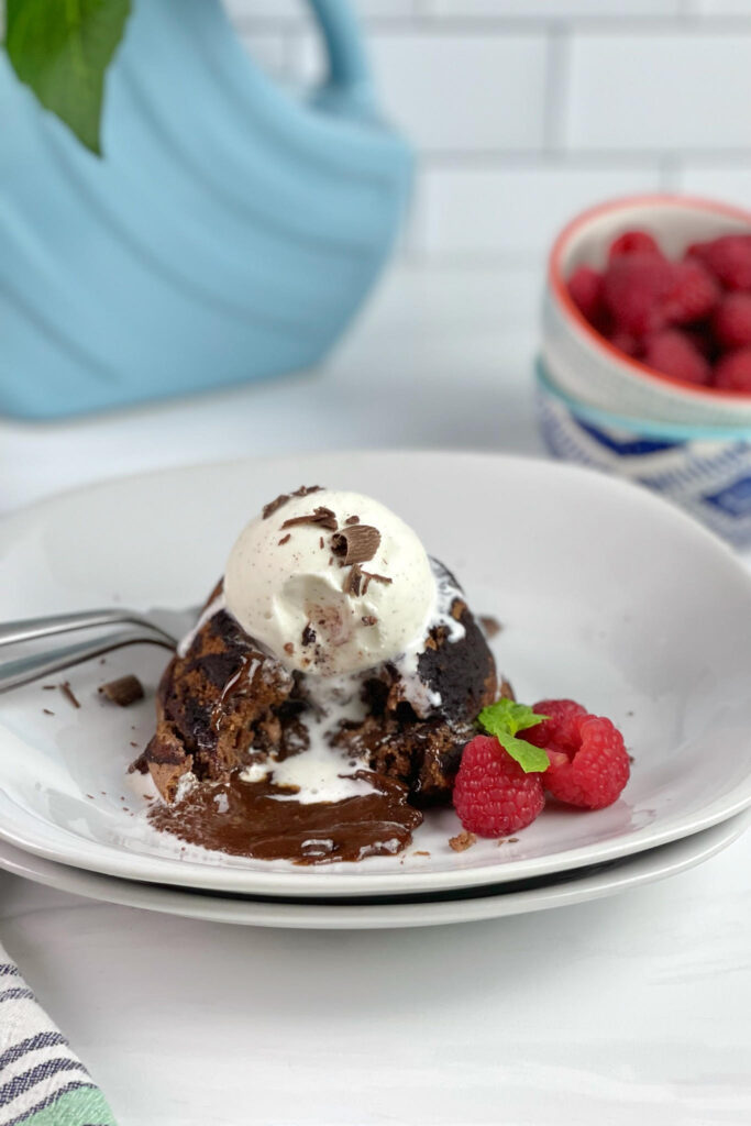 This decadent Lava Cake is filled with gooey, melted chocolate surrounded by moist chocolate cake. It is the perfect dessert for an easy fancy dessert.