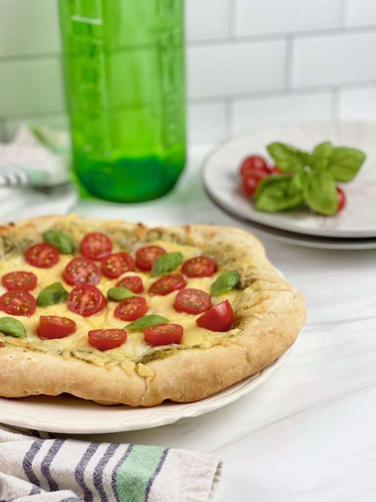 Are you always looking for quick dinner ideas that the whole family will enjoy? This flavorful and savory Three Cheese Pesto Pizza is a family favorite.