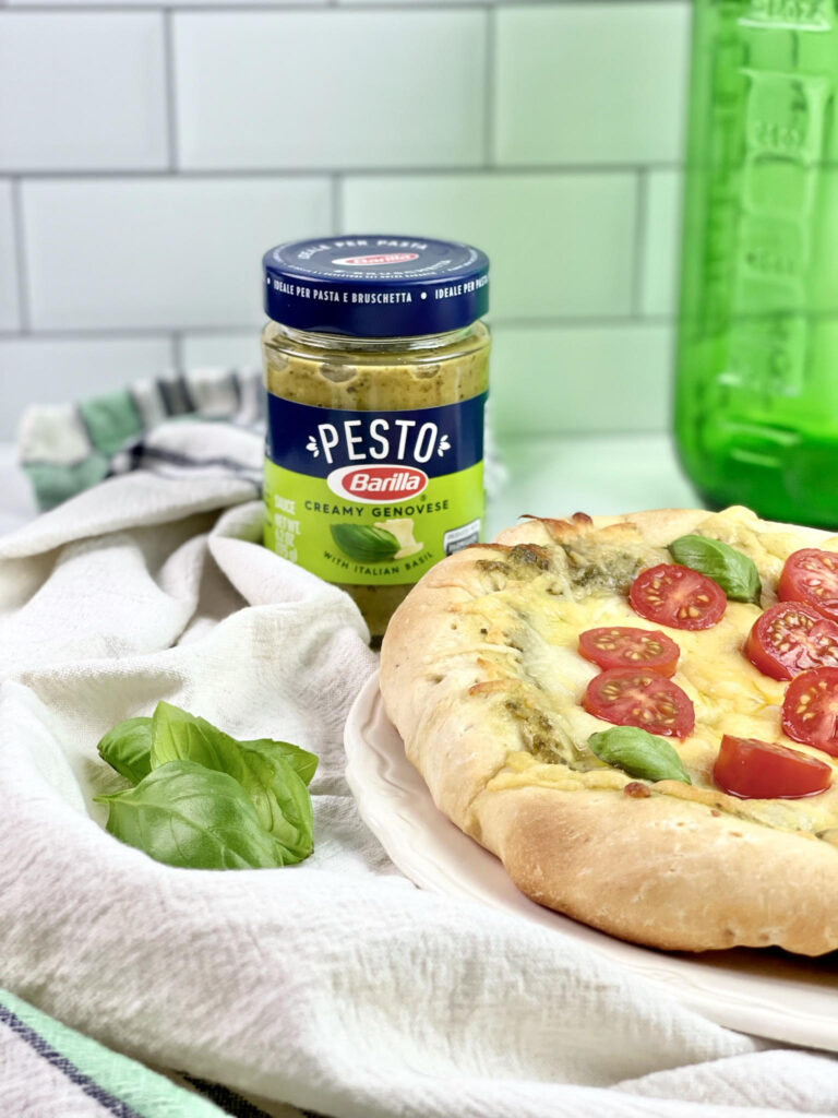 Are you always looking for quick dinner ideas that the whole family will enjoy? This flavorful and savory Three Cheese Pesto Pizza is a family favorite.
