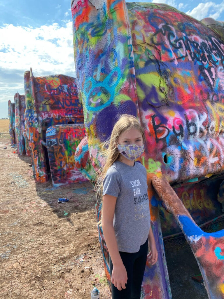 Everything you need to know about visiting Cadillac Ranch. This kitsch roadside attraction located near Amarillo, Texas is an experience you don't want to miss.