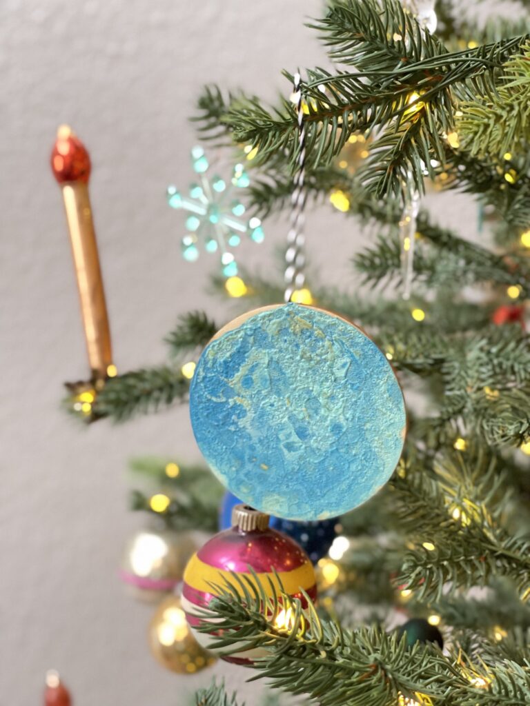 Full instructions on how to make Acrylic Pour Ornaments with kids! These make perfect gifts for grandparents and extended family members.