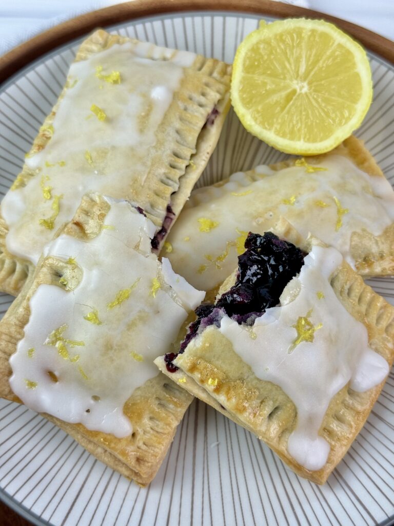 These Blueberry Lemon Pop Tarts are delicious and made using easy homemade pastry dough, blueberry compote, and lemon icing.