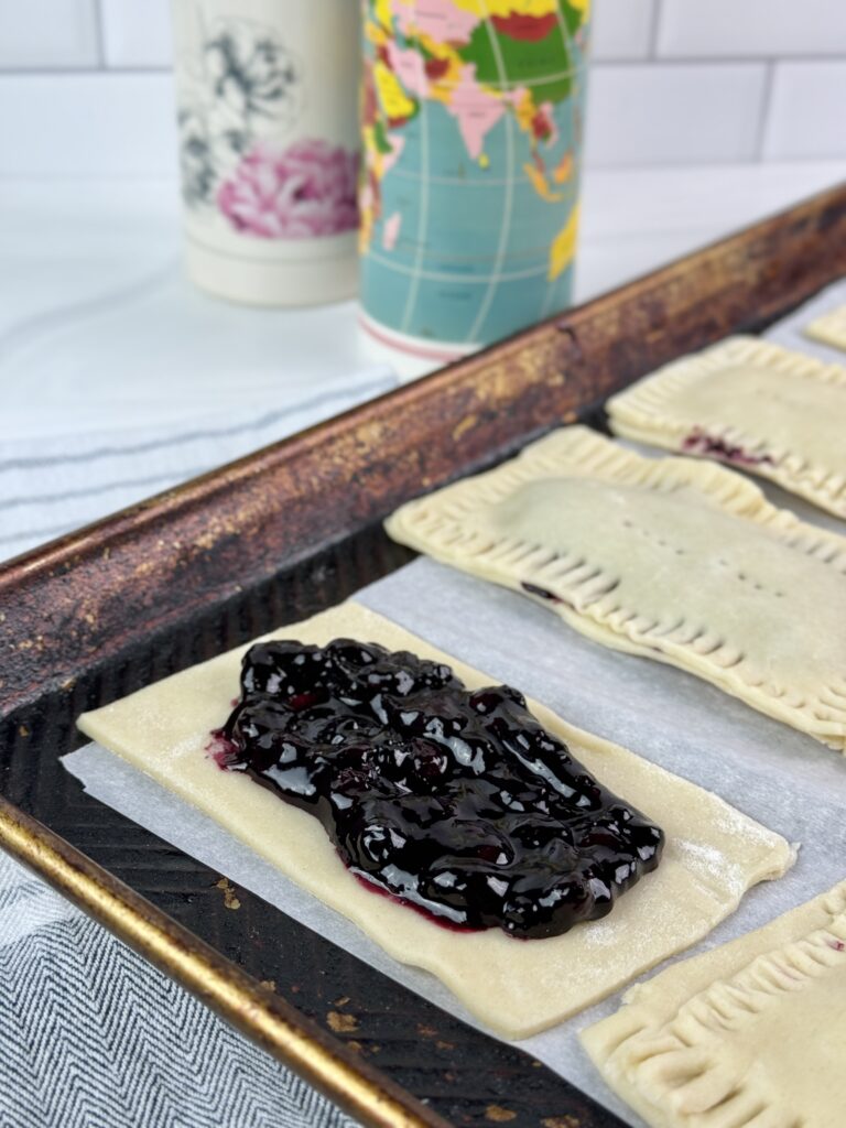 These Blueberry Lemon Pop Tarts are delicious and made using easy homemade pastry dough, blueberry compote, and lemon icing.